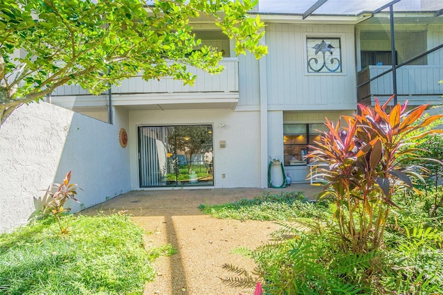 property entrance with a patio