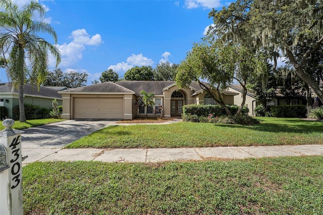 single story home with a garage and a front yard