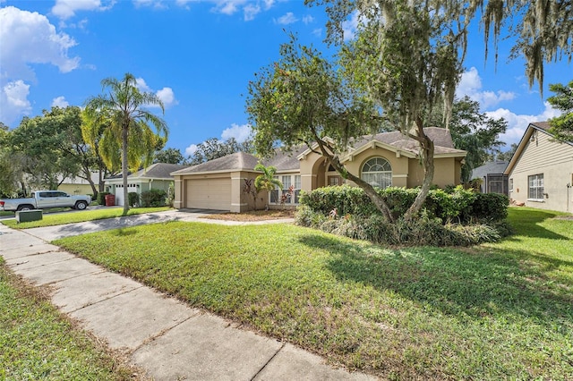 single story home featuring a garage and a front lawn