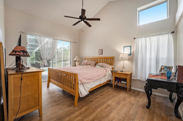 bedroom with high vaulted ceiling, hardwood / wood-style flooring, and ceiling fan