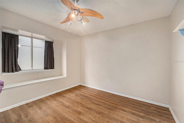 unfurnished room featuring a textured ceiling, ceiling fan, and wood-type flooring