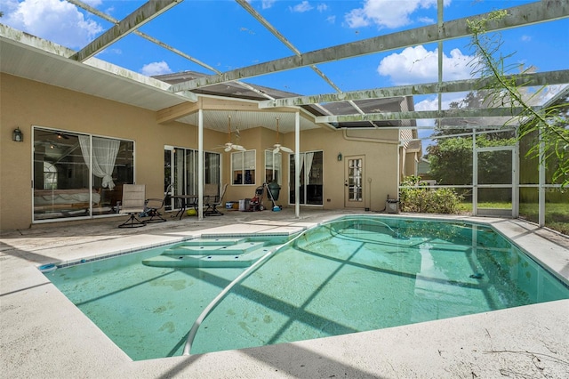 view of swimming pool with a patio and a lanai