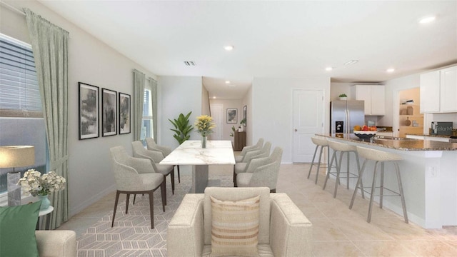 dining space with light tile patterned floors, baseboards, visible vents, and recessed lighting