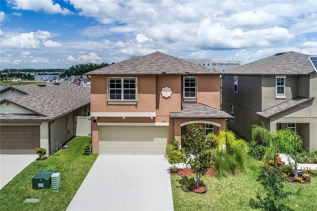 view of front of house featuring a front yard and a garage