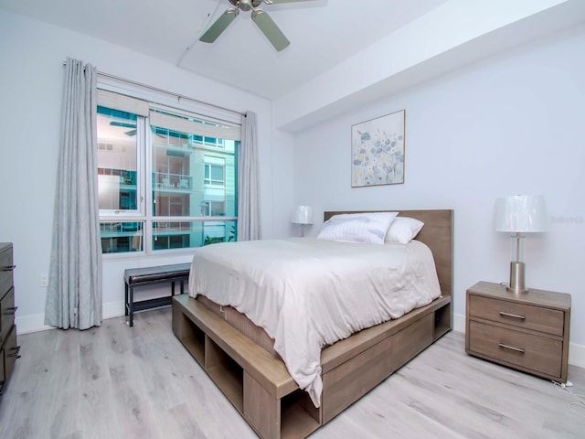 bedroom featuring ceiling fan and light hardwood / wood-style floors