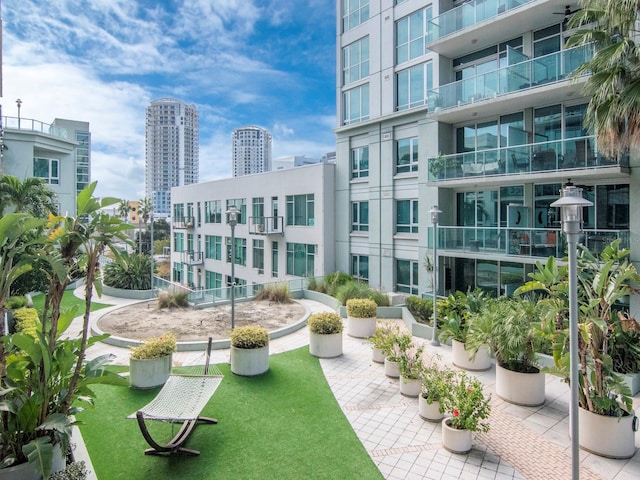 view of home's community featuring a lawn