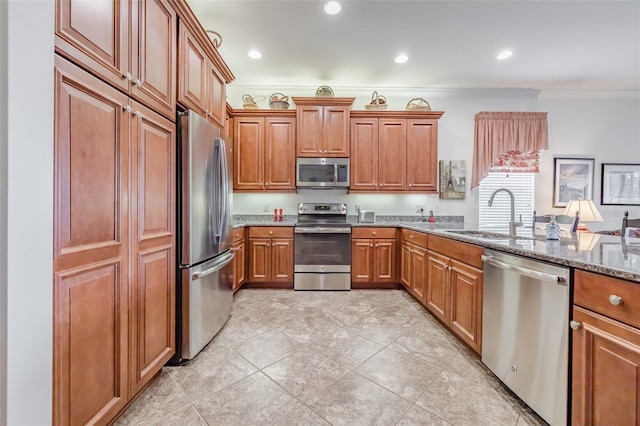 kitchen with stone counters, sink, stainless steel appliances, crown molding, and light tile patterned flooring