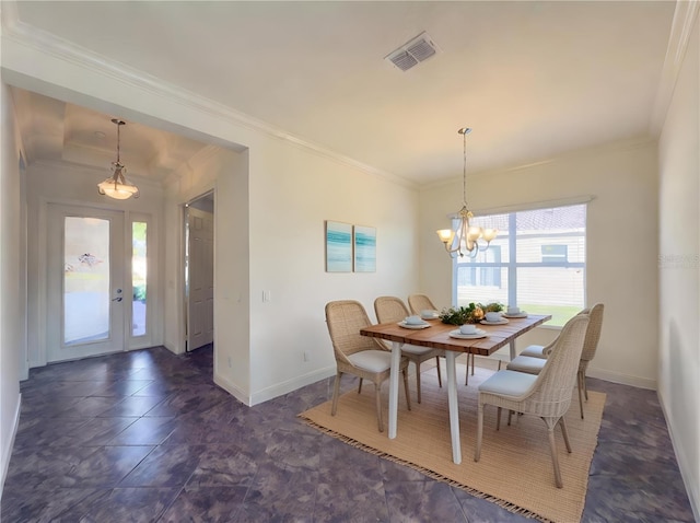 dining area with a chandelier and ornamental molding