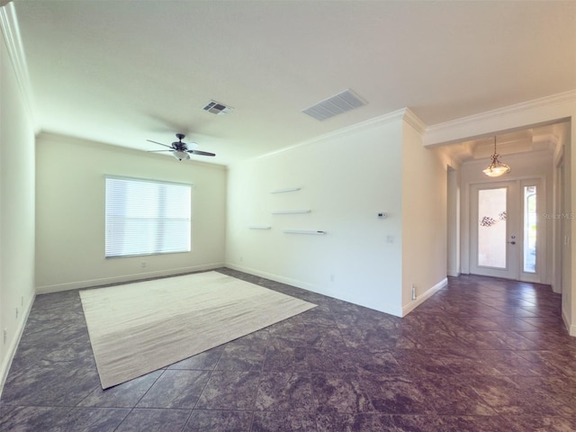 spare room with ceiling fan, a healthy amount of sunlight, and ornamental molding