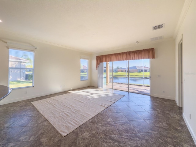 spare room with a water view and ornamental molding