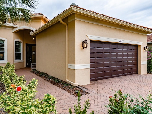 view of side of property with a garage