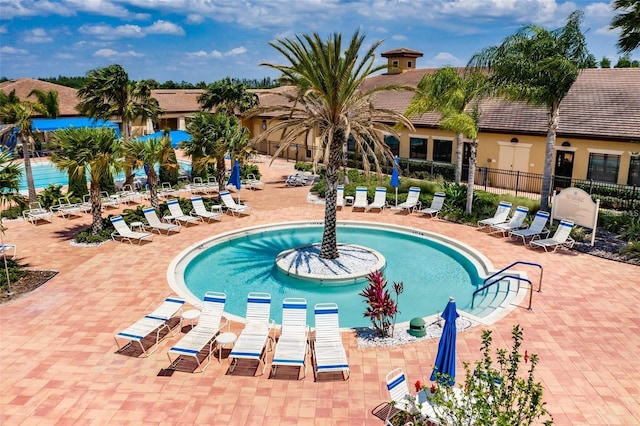 view of swimming pool featuring a patio area