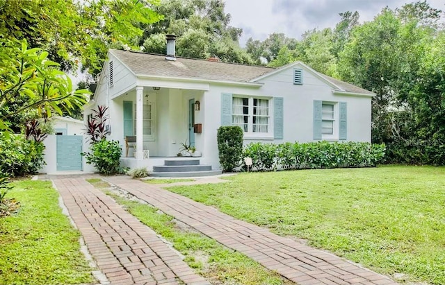 view of front of house featuring a front yard and a porch