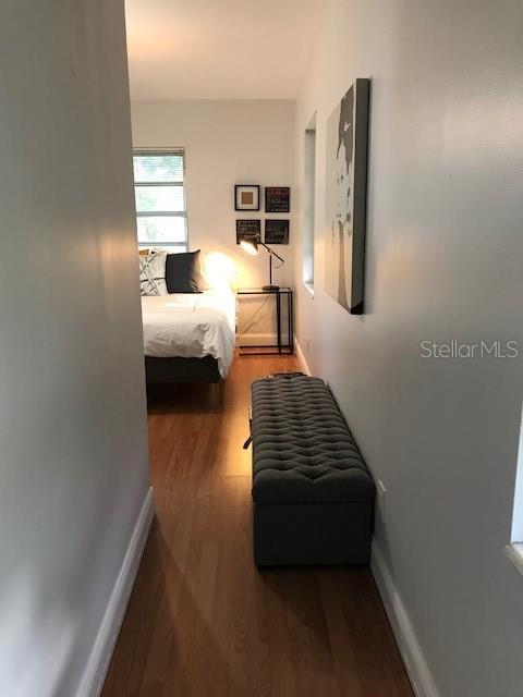 bedroom with wood-type flooring