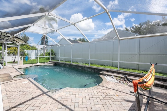 view of pool with a lanai and a patio area