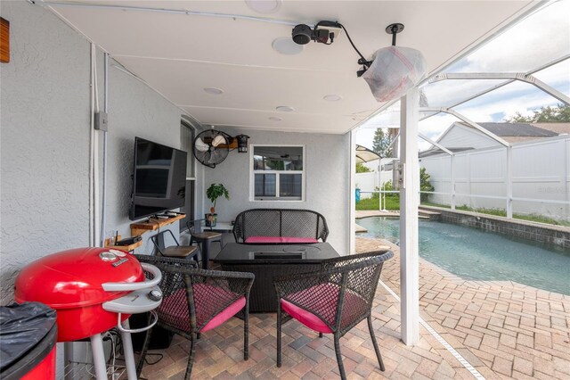 view of patio / terrace featuring a lanai