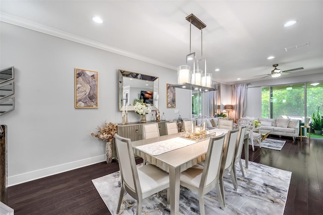 dining room with crown molding, dark wood-type flooring, and ceiling fan