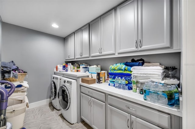 laundry area featuring cabinets and independent washer and dryer