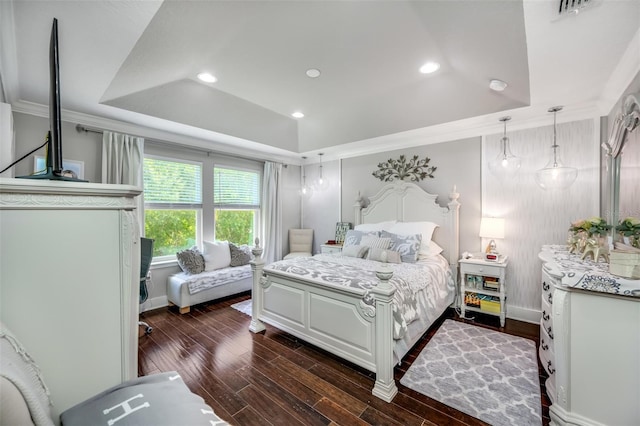 bedroom featuring lofted ceiling, a tray ceiling, dark hardwood / wood-style floors, and crown molding