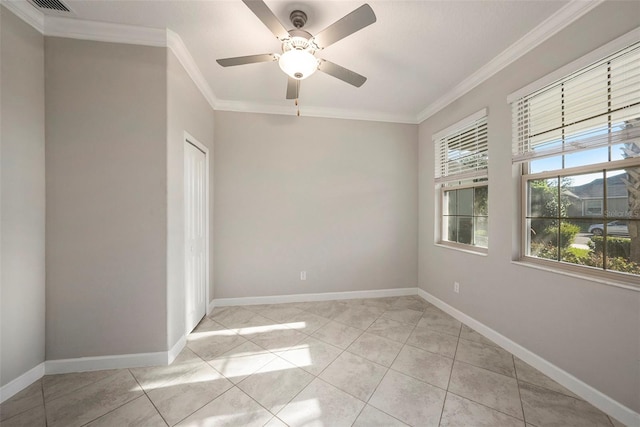 tiled empty room featuring ceiling fan and ornamental molding