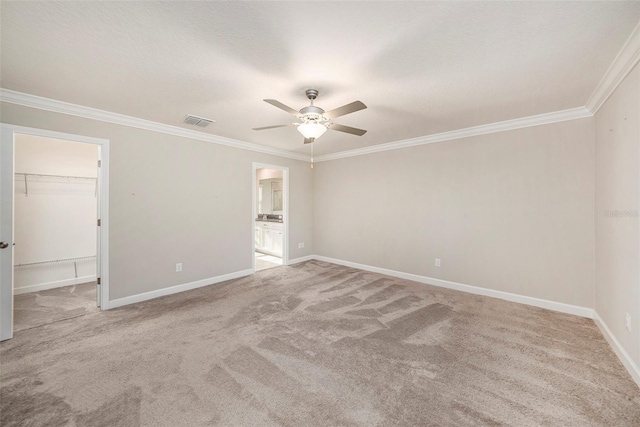 unfurnished room with light carpet, crown molding, and ceiling fan