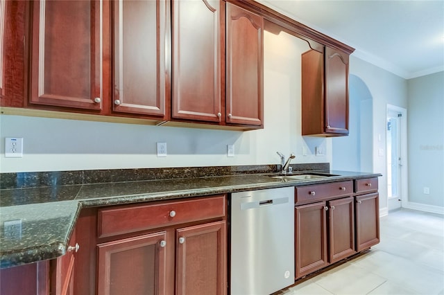 kitchen with dark stone countertops, light tile patterned floors, dishwasher, crown molding, and sink