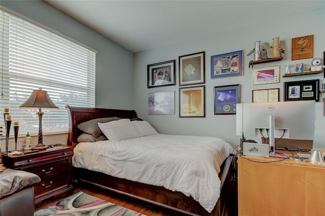 bedroom with hardwood / wood-style floors