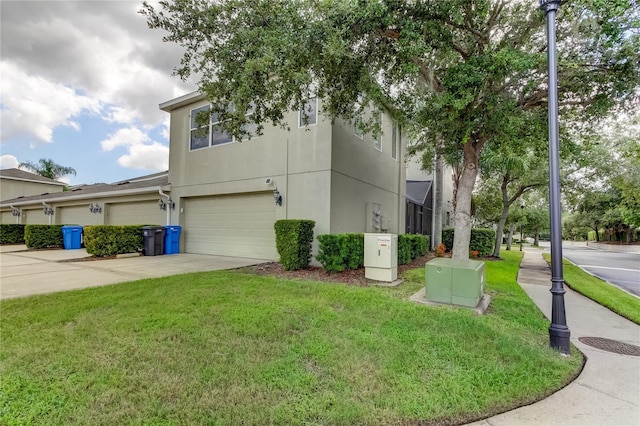 view of front facade featuring a garage and a front lawn