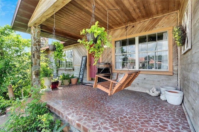 view of patio featuring a porch