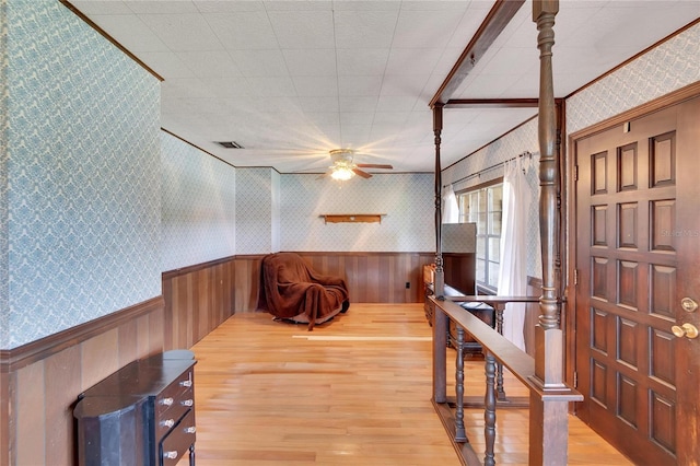 foyer featuring ceiling fan and light hardwood / wood-style floors