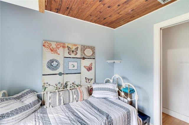 bedroom featuring wood-type flooring and wooden ceiling