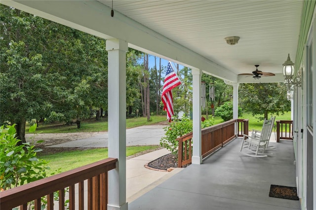 view of patio featuring ceiling fan and a porch