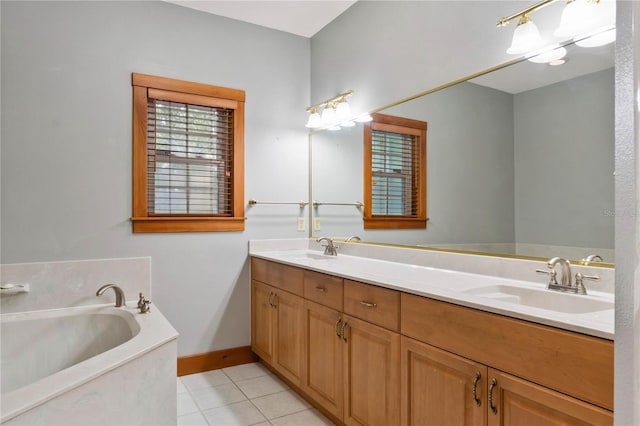 bathroom with vanity, tile patterned floors, and a tub