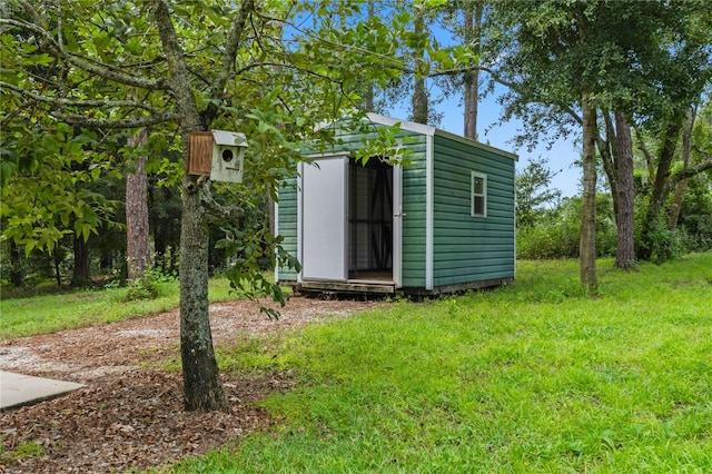 view of outdoor structure with a yard