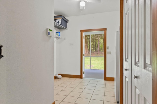 doorway to outside with light tile patterned floors and ceiling fan