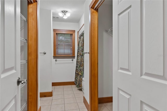 hallway with light tile patterned floors