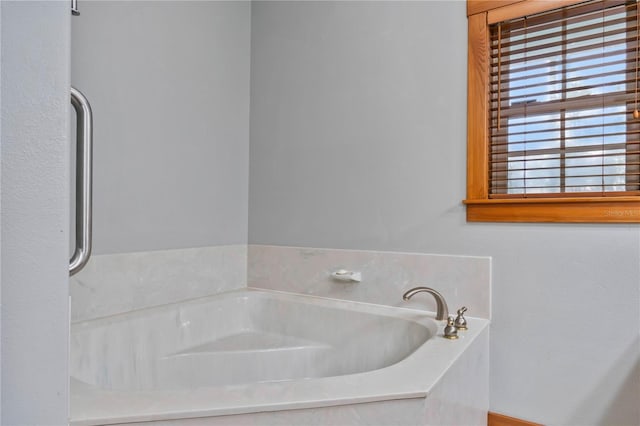 bathroom with a tub