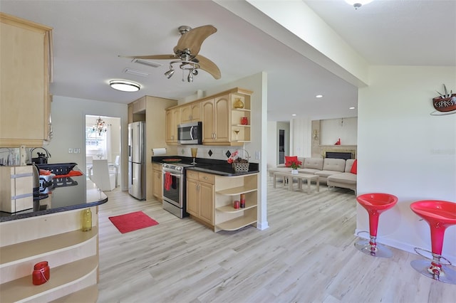 kitchen with light hardwood / wood-style flooring, light brown cabinetry, stainless steel appliances, sink, and ceiling fan