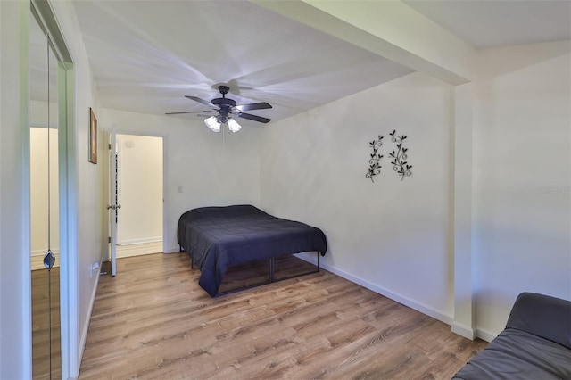 bedroom featuring light hardwood / wood-style flooring and ceiling fan