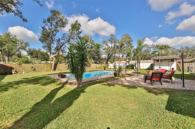 view of yard with a fenced in pool and a patio area