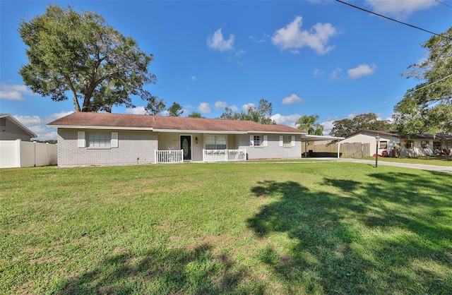 rear view of property with a yard