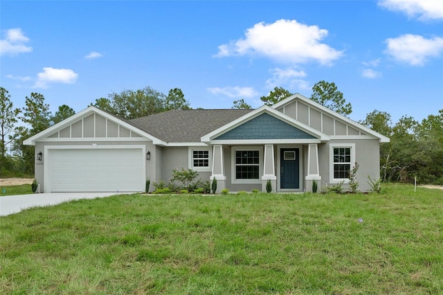 view of front of home featuring a front yard and a garage