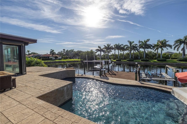 view of swimming pool featuring a boat dock and a water view