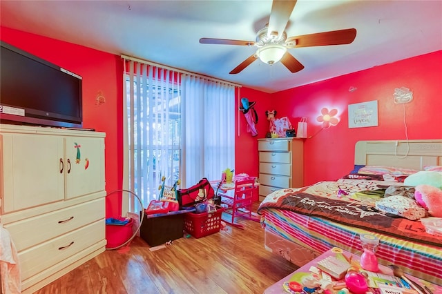 bedroom featuring hardwood / wood-style floors and ceiling fan