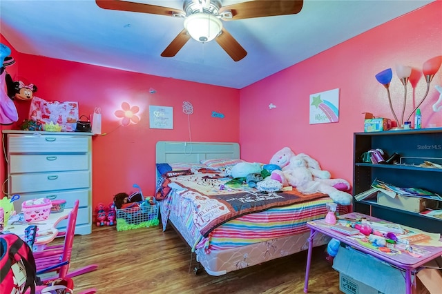 bedroom featuring ceiling fan and hardwood / wood-style flooring