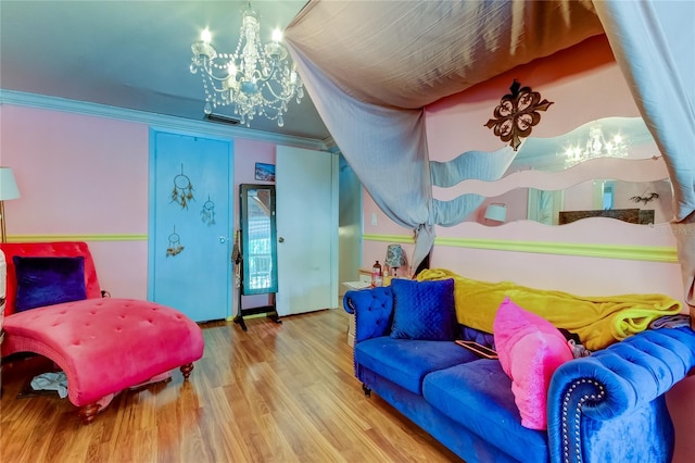 bedroom with hardwood / wood-style flooring, crown molding, and a notable chandelier