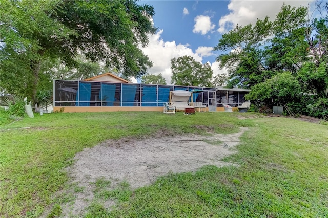 view of yard featuring a sunroom