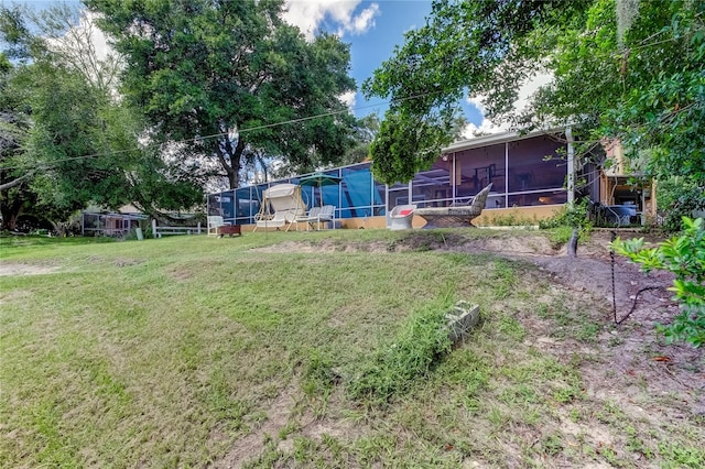 view of yard with a sunroom