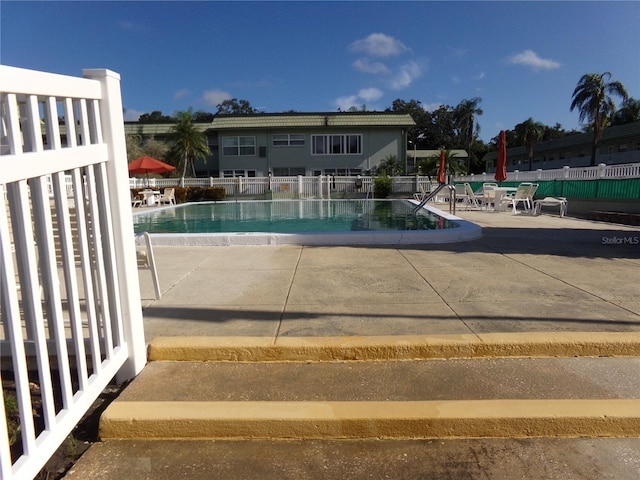 view of swimming pool featuring a patio