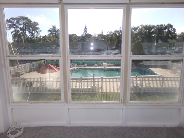 interior space featuring carpet flooring and a pool